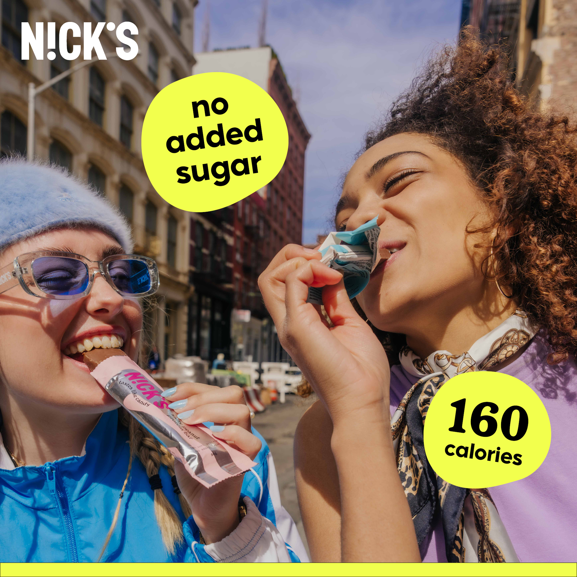 An unwrapped N!CK'S Coconut Candy Bar next to its wrapper, highlighting its texture and chocolate coating.